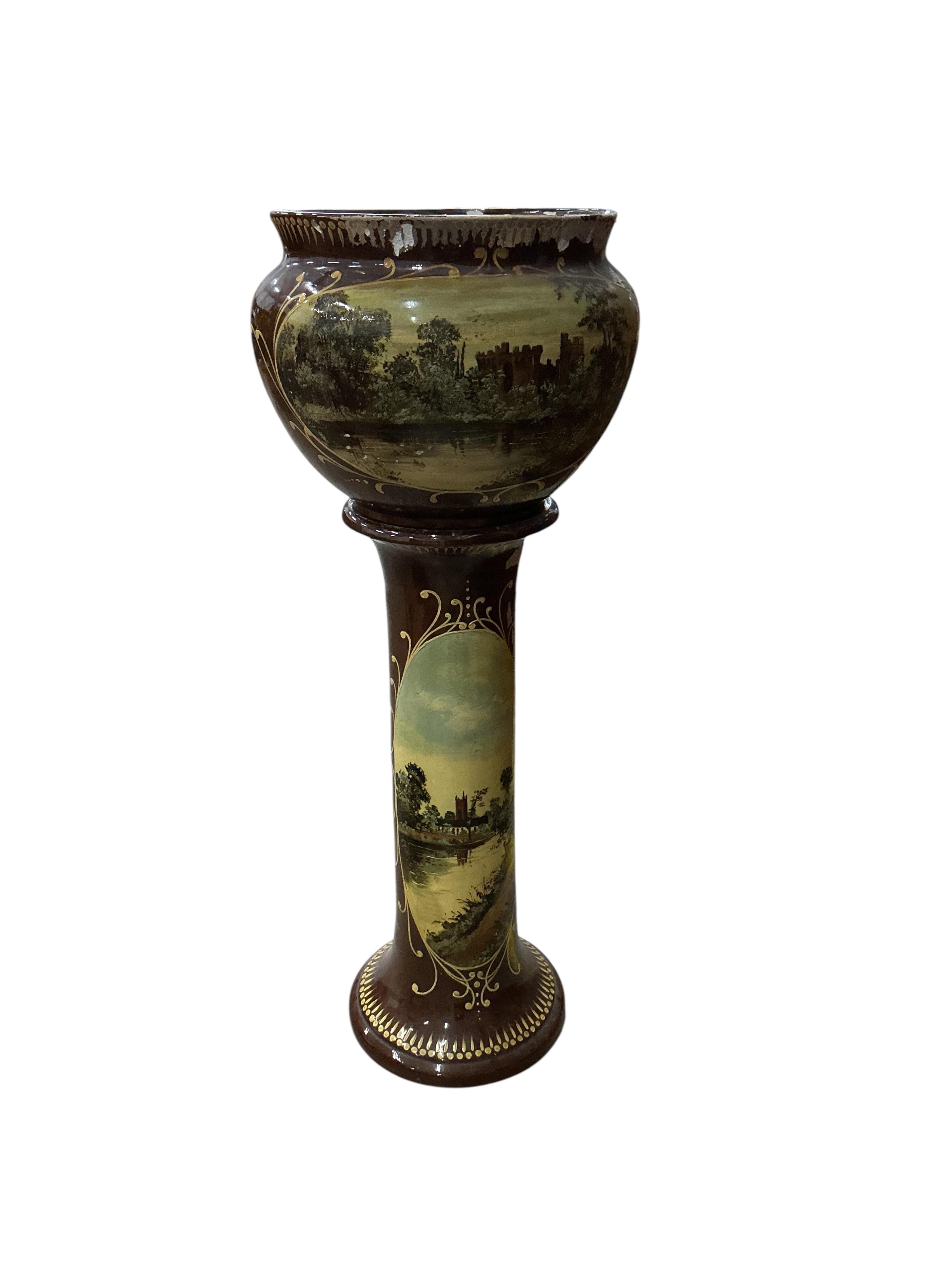 A Victorian glazed earthenware jardiniere on stand, diameter 44cm, height 108cm